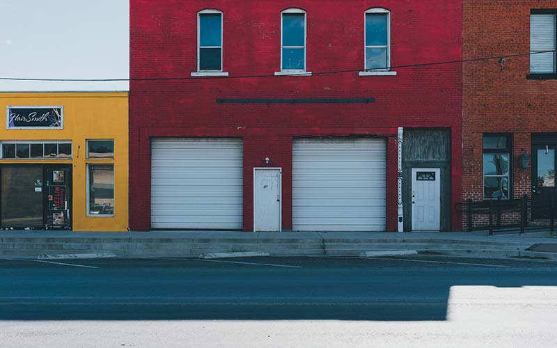 Commercial garage doors on red building