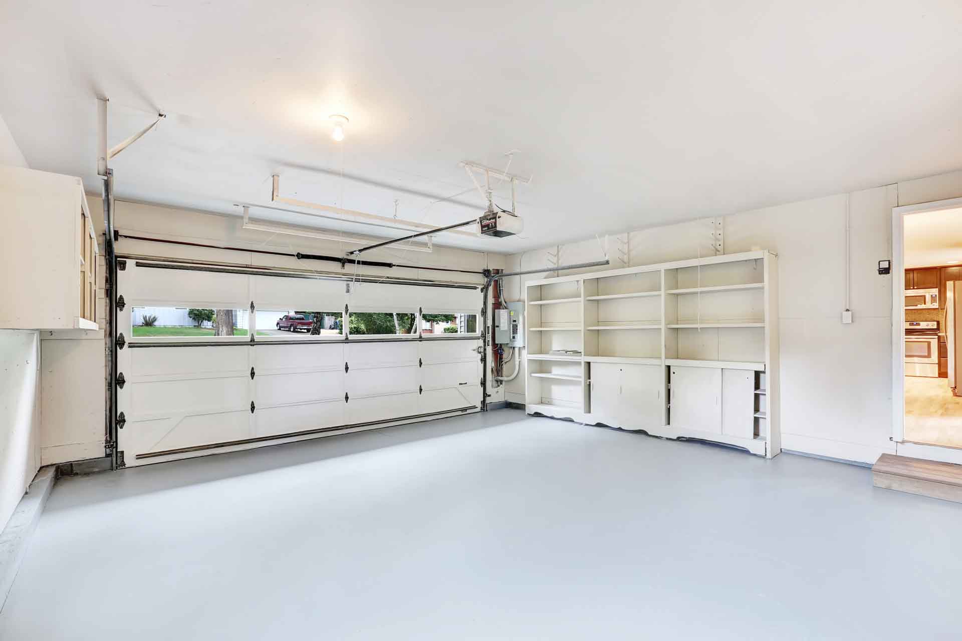 Interior of a clean garage with a new Liftmaster garage door opener