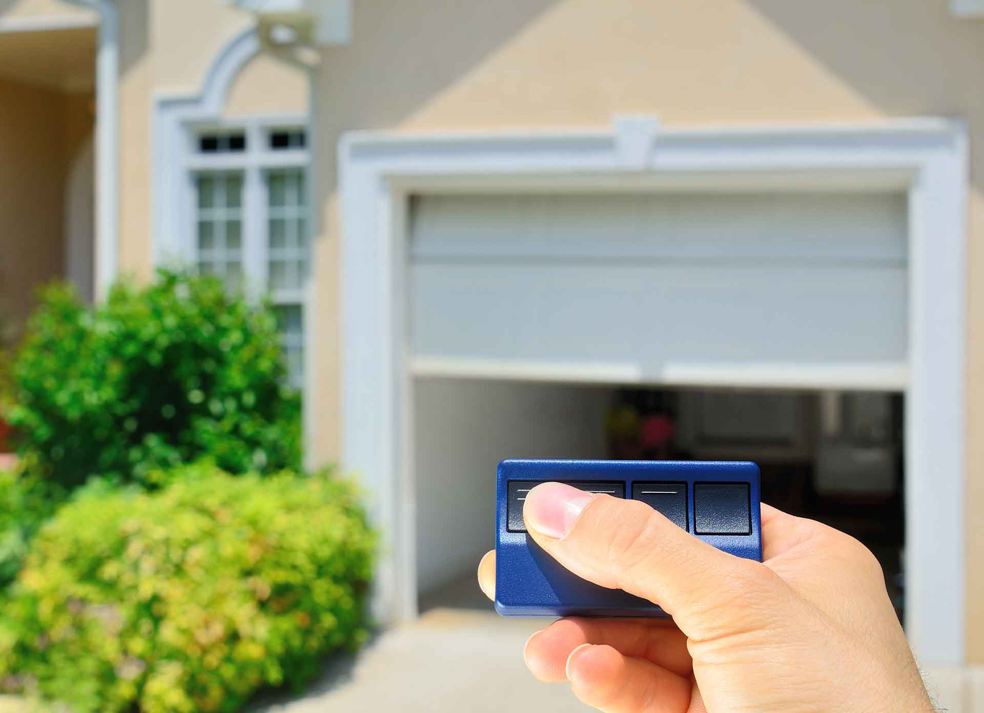 Opening garage door with blue garage door opener