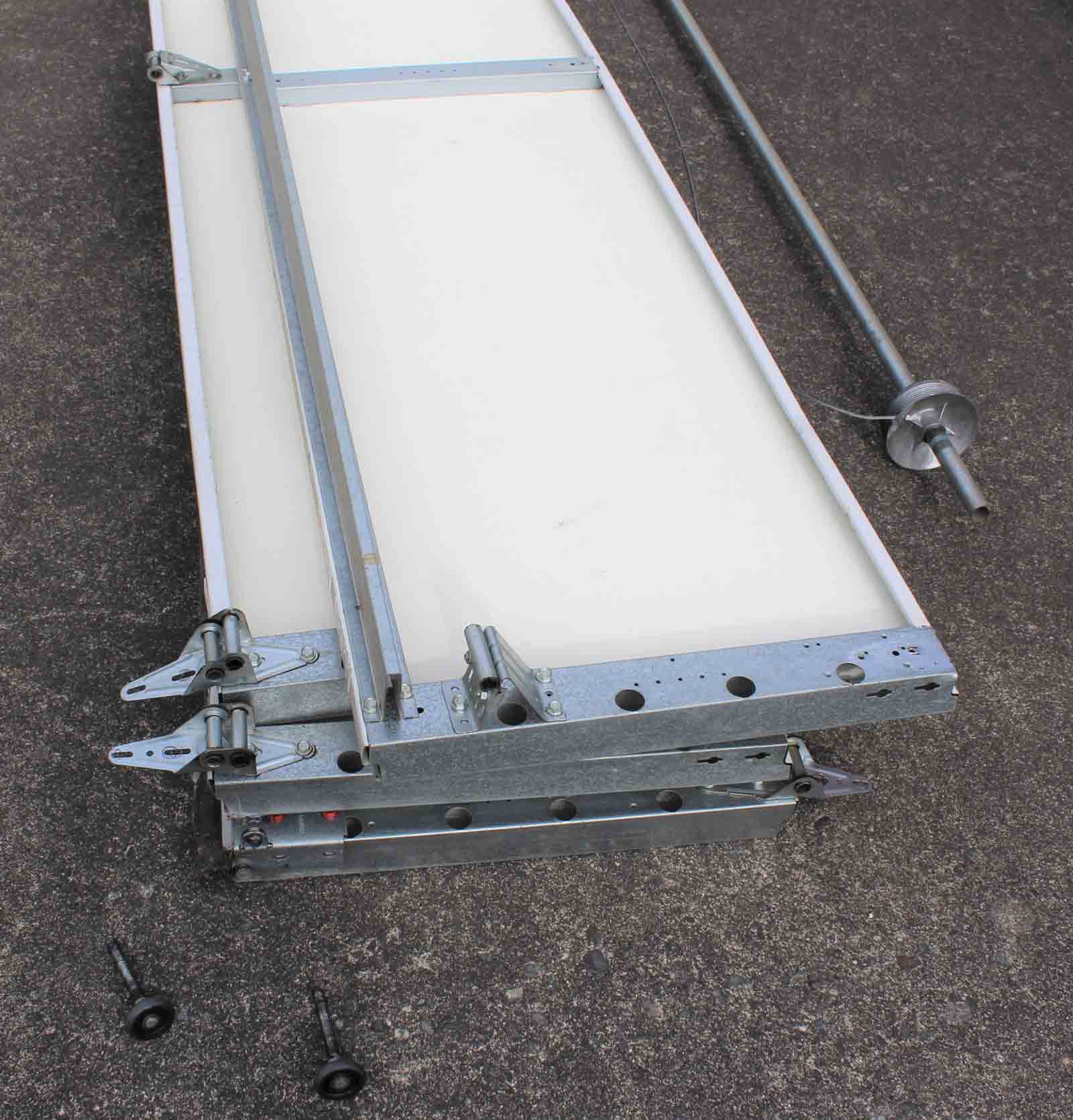 Single garage door panels on the ground